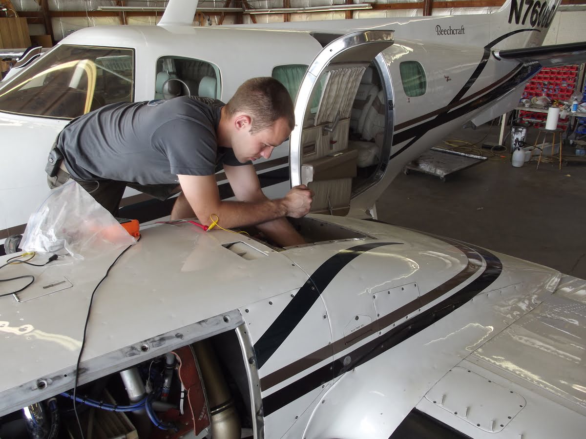 Michael Sawyer working on small aircraft