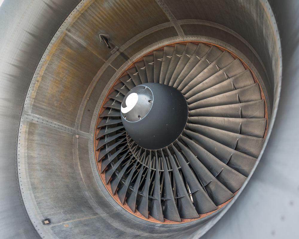 Jet aircraft mechanic performing OJT maintenance